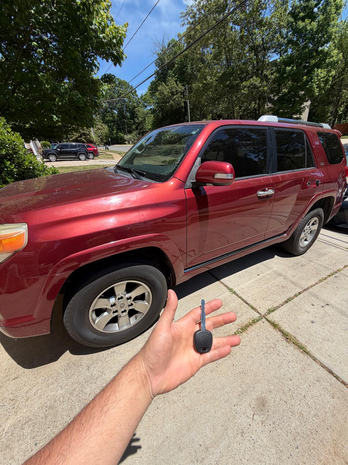 Charlotte Locksmith technician holding newly cut transponder keys on-site in Charlotte, NC